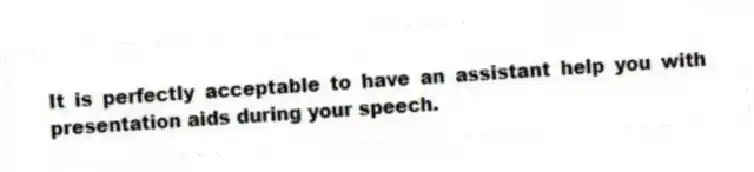 It is perfectly acceptable to have an assistant help you with presentation aids during your speech.