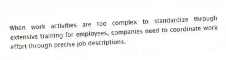 When work activities are too complex to standardize through extensive training for employees, companies need to coordinate work effort through precise job descriptions.