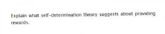Explain what self-determination theory suggests about providing rewards.