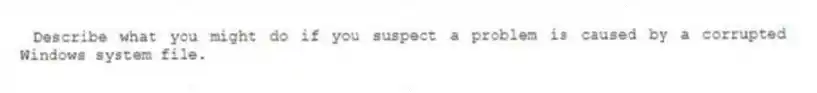 Describe what you might do if you suspect a problem is caused by a corrupted Windows system file.